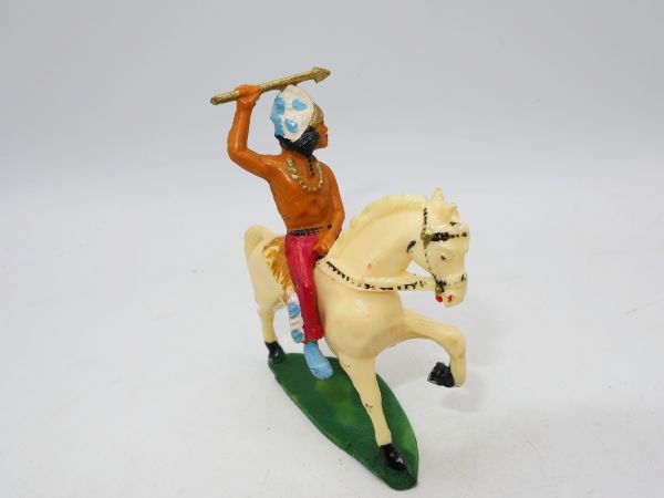 Starlux Indian on horseback, holding arrow above - early figure