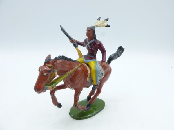 Merten Indian on horseback, rifle sideways at the hip