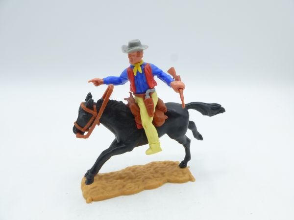 Timpo Toys Cowboy riding, rifle sideways, pointing