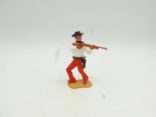 Timpo Toys Cowboy 3. Version stehend, Gewehr schießend