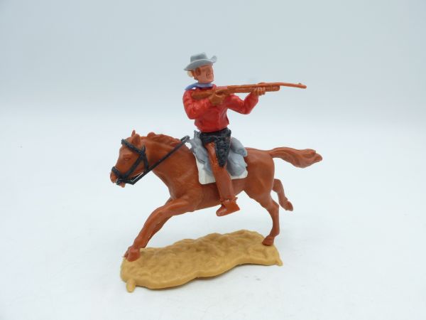 Timpo Toys Cowboy 3. Version reitend, Gewehr schießend