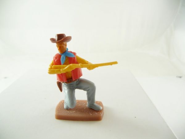 Plasty Cowboy kneeling firing with rifle