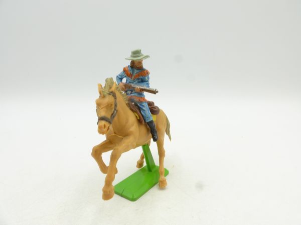 Britains Deetail Cowboy riding, rifle in front of the body