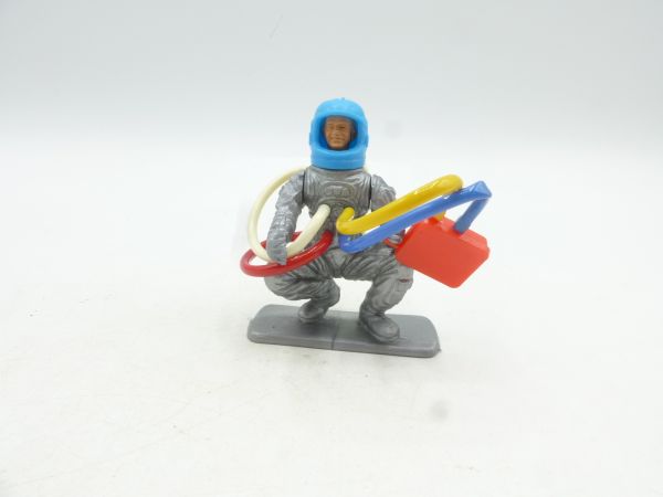 Astronaut kneeling with accessories, multi-part, movable arms
