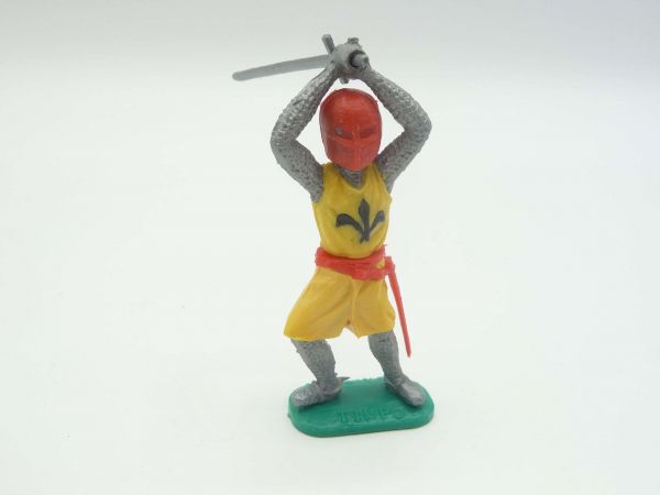 Timpo Toys Medieval knight standing, striking ambidextrously over head, yellow/red