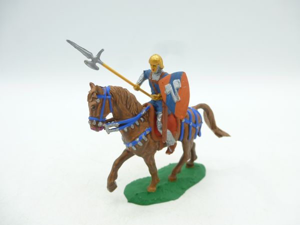 Norman on horseback with spear + shield on walking horse