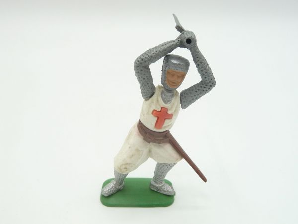 Crusader standing, ambidextrous with sword over head