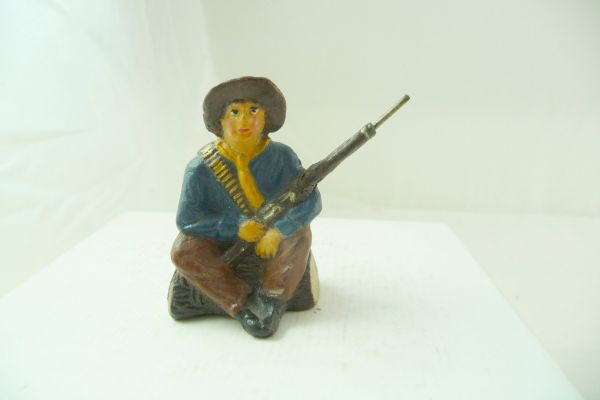 Pfeiffer / Tipple Topple Cowboy sitting on tree trunk with rifle - good condition