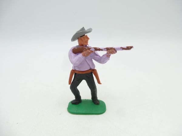 Timpo Toys Cowboy 1. Version, flieder, Gewehr schießend