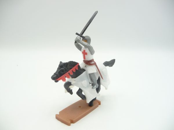 Plasty Crusader on horseback, striking sword ambidextrously over head