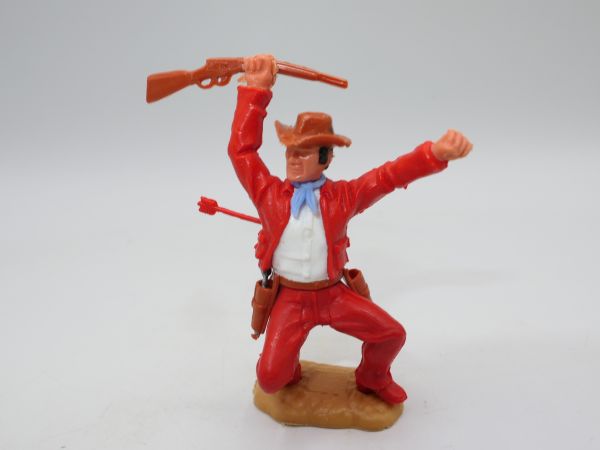 Timpo Toys Cowboy 3. Version hockend, von Pfeil getroffen, rot/rot