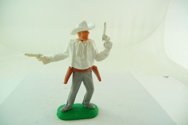 Timpo Toys Cowboy 1. Version, 2 Pistolen wild schießend, weiß