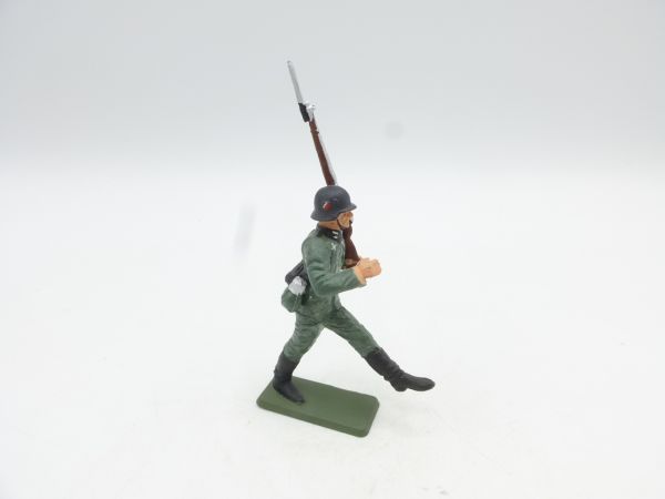 Starlux Soldier goose-stepping, rifle shouldered