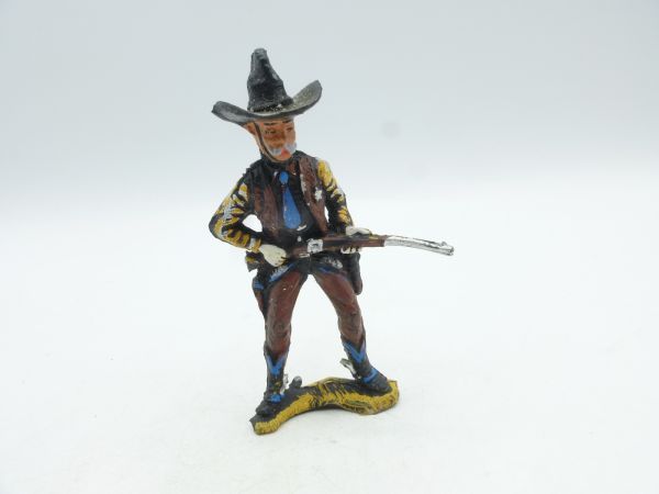 Chromoplast Sheriff standing, rifle in front of body