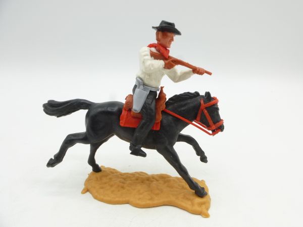 Timpo Toys Cowboy riding, shooting with short rifle