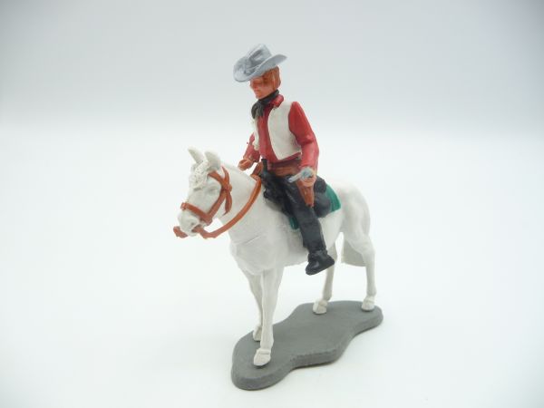 Timpo Toys Cowboy 3. Version reitend mit Pistole, auf stehendem Pferd