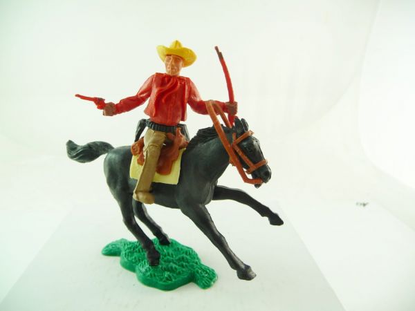 Timpo Toys Cowboy 1st version riding with rifle + pistol, red