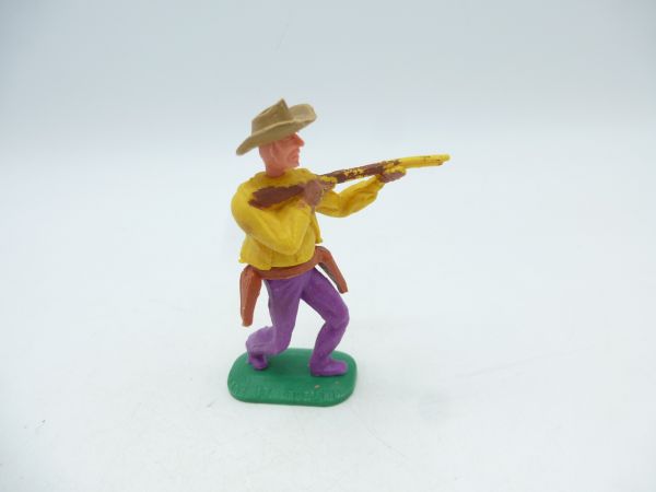 Timpo Toys Cowboy 1. Version, tiefgelb, Gewehr schießend