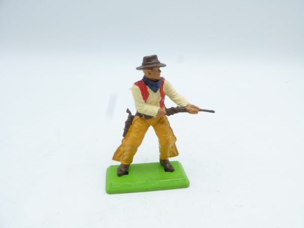 Britains Deetail Cowboy standing, shooting rifle from the hip