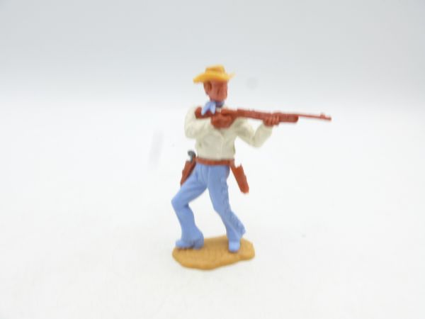 Timpo Toys Cowboy 3. Version vorgehend, Gewehr schießend