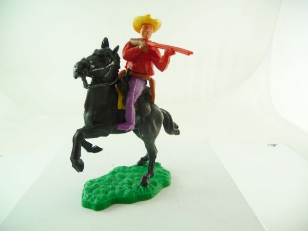 Timpo Toys Cowboy 1st version riding, firing with rifle - great colour combination