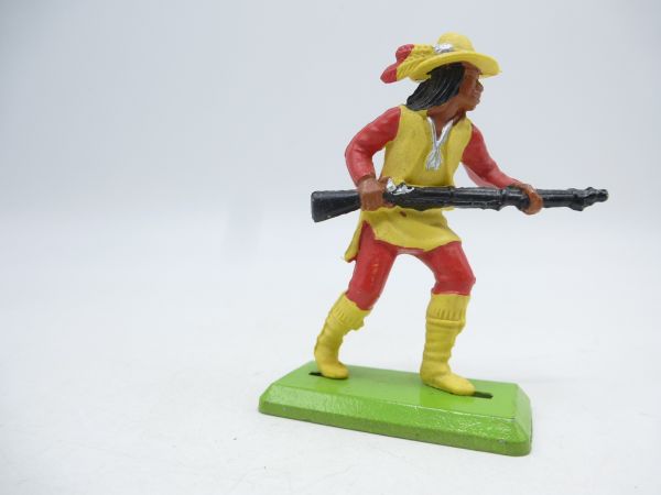 Britains Deetail Apache mit Gewehr vor dem Körper vorgehend, gelb/rot