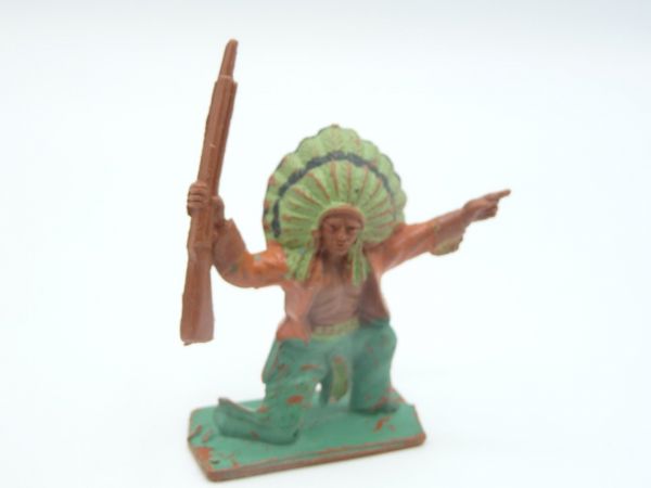 Lone Star Indian kneeling with rifle, pointing