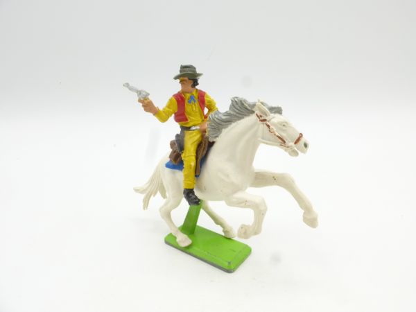 Britains Deetail Cowboy riding, shooting pistol sideways
