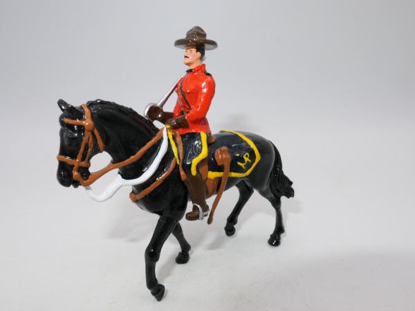 Mountie on horseback with sabre (similar to Britains)