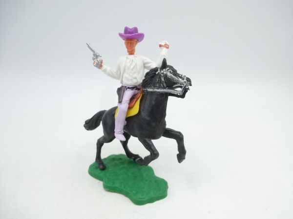 Timpo Toys Cowboy 1. Version reitend mit Pistole, andere Hand erhoben