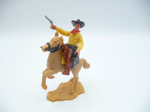 Timpo Toys Cowboy 2. Version reitend mit Geldtasche + Pistole