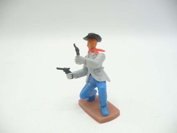 Plasty Cowboy kneeling, firing wild with 2 pistols