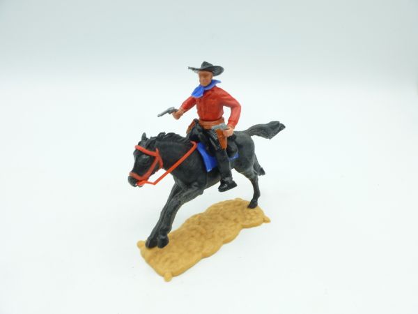 Timpo Toys Cowboy riding, firing with 2 pistols