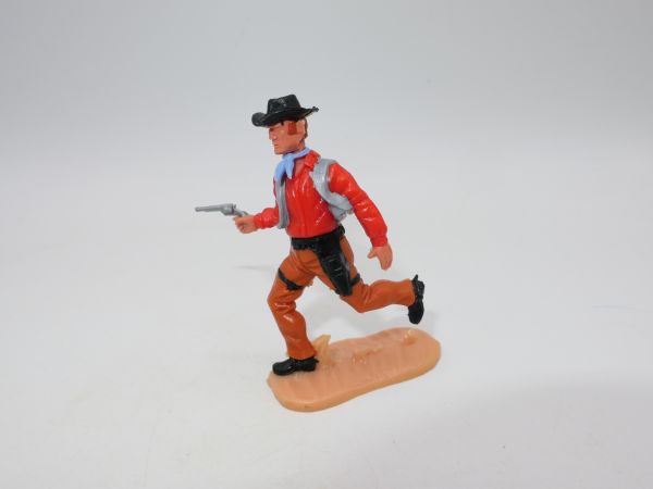 Timpo Toys Cowboy 4th version walking with pistol, brown trousers