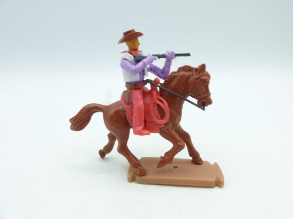 Plasty Cowboy riding, shooting rifle