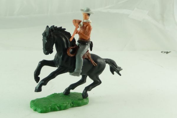 Elastolin Cowboy riding, firing with rifle