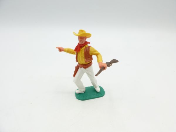 Timpo Toys Cowboy 2nd version standing with brown Winchester, pointing