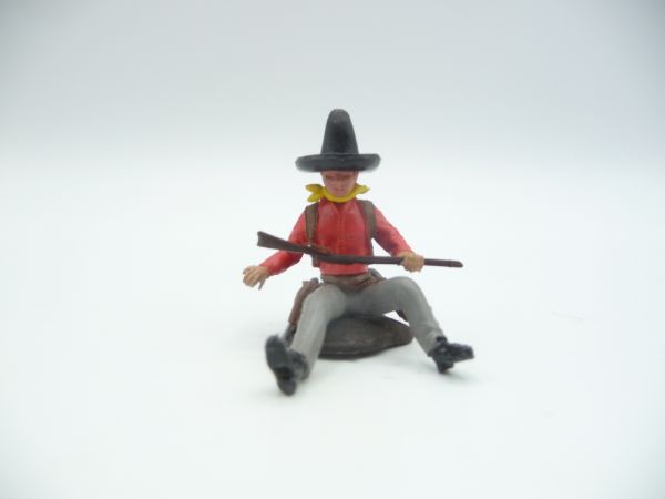 Britains Swoppets Cowboy sitting at a trunk with rifle