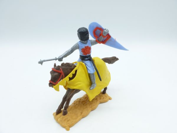 Timpo Toys Mittelalterritter reitend, hellblau/rot mit Schwert