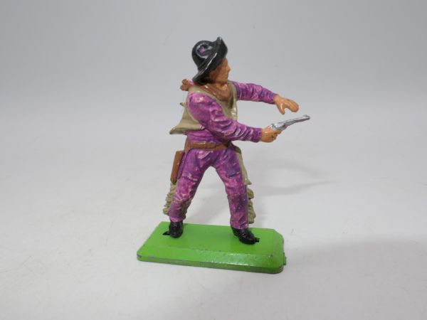 Britains Deetail Cowboy shooting pistol with both hands, purple clothes