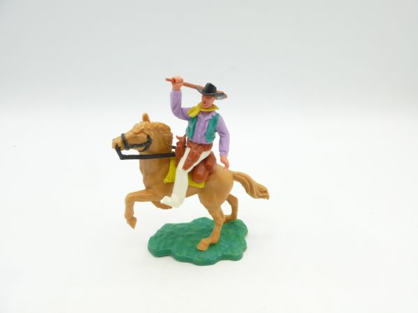 Timpo Toys Cowboy reitend, Gewehr schlagend, weißes Unterteil