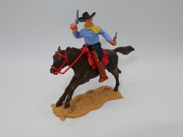 Timpo Toys Cowboy riding, shooting wildly with 2 pistols