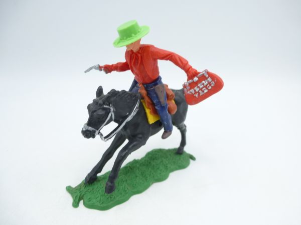 Timpo Toys Cowboy 1. Version reitend mit Pistole + Geldtasche