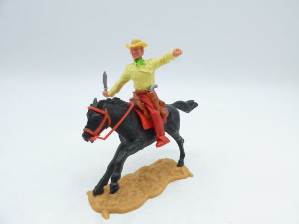 Timpo Toys Cowboy 3rd version riding with knife, green neckerchief