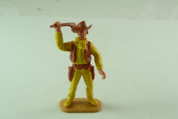 Timpo Toys Cowboy gelb/braun mit Gewehr von oben schlagend