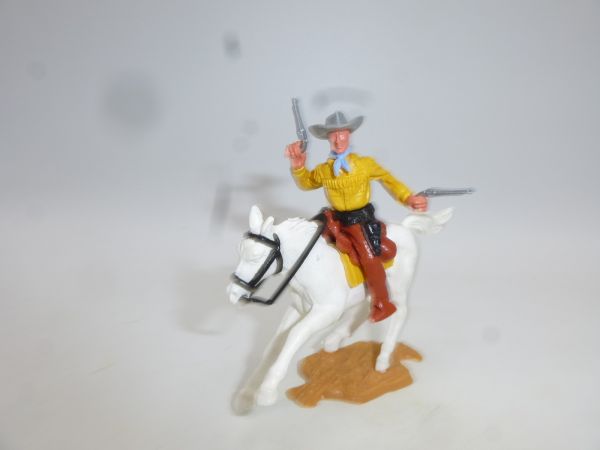 Timpo Toys Cowboy 2nd version riding, firing 2 pistols wildly