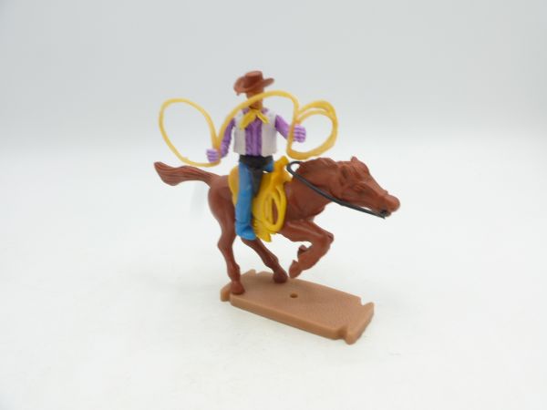 Plasty Cowboy riding with lasso