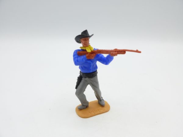 Timpo Toys Cowboy 2nd version standing, rifle firing, medium blue