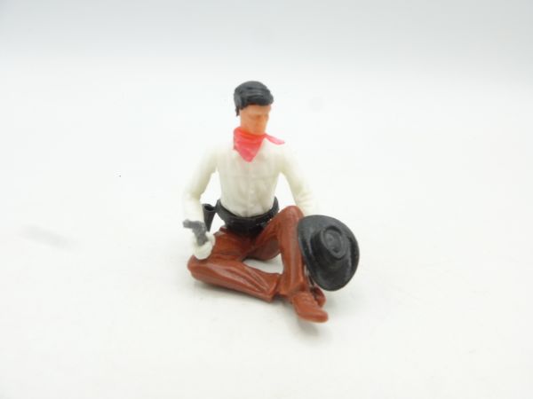 Elastolin 5,4 cm Cowboy sitzend mit Pistole, Hut in der Hand