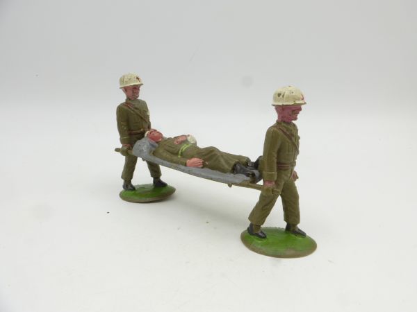 Transport of injured with 2 soldiers with wounded on stretcher